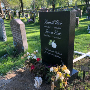 picture of installed peaceyard gravestone, model ada in deep night sky color with standard base