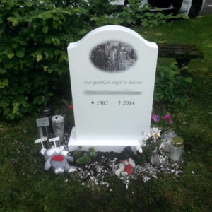 picture of installed peaceyard gravestone, model cora in glacier white color with standard base