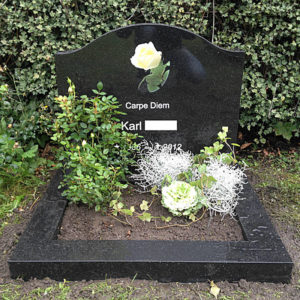 picture of installed peaceyard gravestone, custom model cora in deep night sky color with standard base and square planter