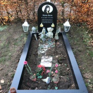 picture of installed peaceyard gravestone, model eliza in deep night sky color with standard base and full wide frame