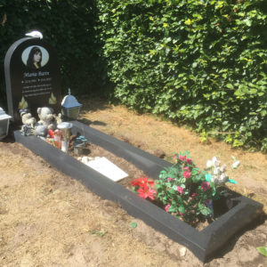 picture of installed peaceyard gravestone, model eliza in deep night sky color with standard base and full frame