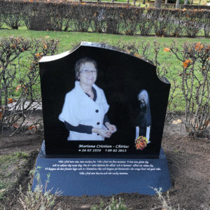 front picture of installed peaceyard gravestone, model meral in deep night sky color with sloped base