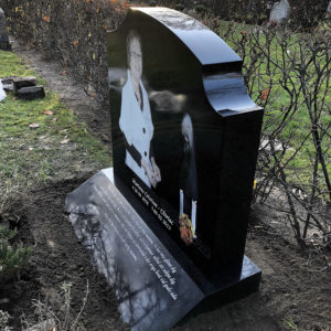 side picture of installed peaceyard gravestone, model meral in deep night sky color with sloped base