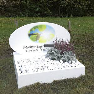 picture of installed peaceyard gravestone, model viola in glacier white color and custom square planter