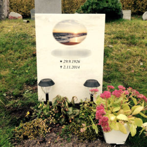 picture of installed peaceyard upright gravestone, model ada in clam shell material with customer graphics