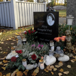 picture of installed peaceyard upright gravestone, model ada in night sky material with customer graphics