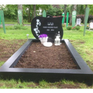 picture of installed peaceyard upright gravestone, model avalie in night sky color with customer graphics