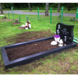 picture of installed peaceyard upright gravestone, model avalie in night sky material with customer graphics