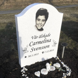 picture of installed peaceyard upright gravestone, model cora in everest material with customer graphics