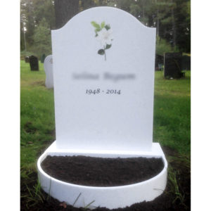 picture of installed peaceyard upright gravestone, model cora in glacier white material with customer graphics
