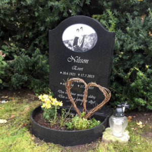 picture of installed peaceyard upright gravestone, model cora in night sky material with customer graphics