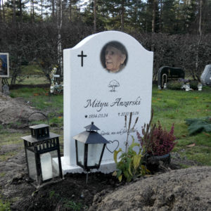 picture of installed peaceyard upright gravestone, model cora in everest material with customer graphics