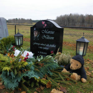 picture of installed peaceyard upright gravestone, model cora in night sky material with standard base and square planter