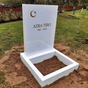 picture of installed peaceyard upright gravestone, Ada in glacier white material with customer graphics